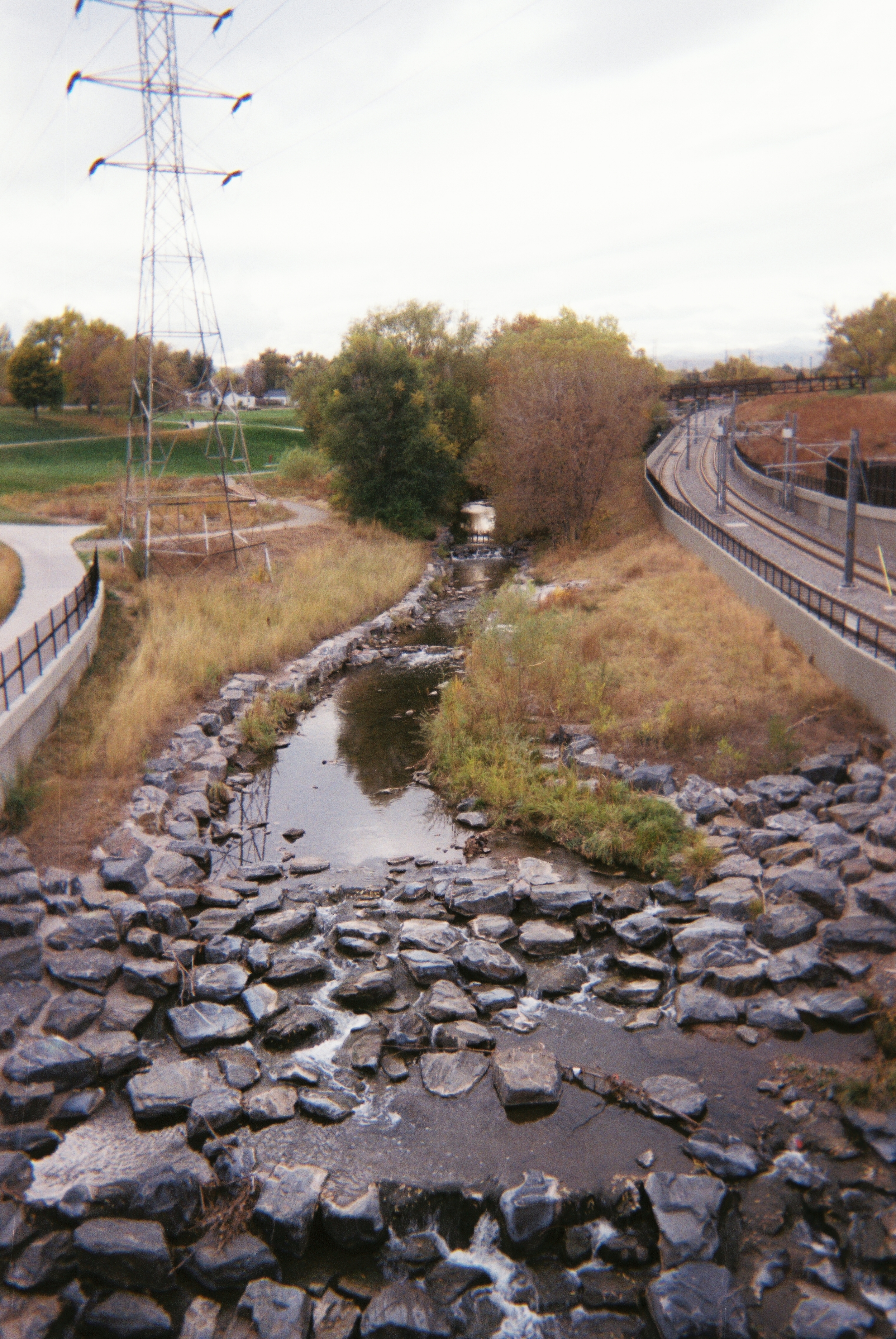 PERFECTLY OUT OF PLACE I passed that creek everyday on my way into DHS. It always seemed out of place amongst the metal of the bridge above it and the materials of the buildings around it. That's what I feel from God's beautiful moments in my life, perfectly out of place amongst daily normalcies. -Courtney Kotowski
