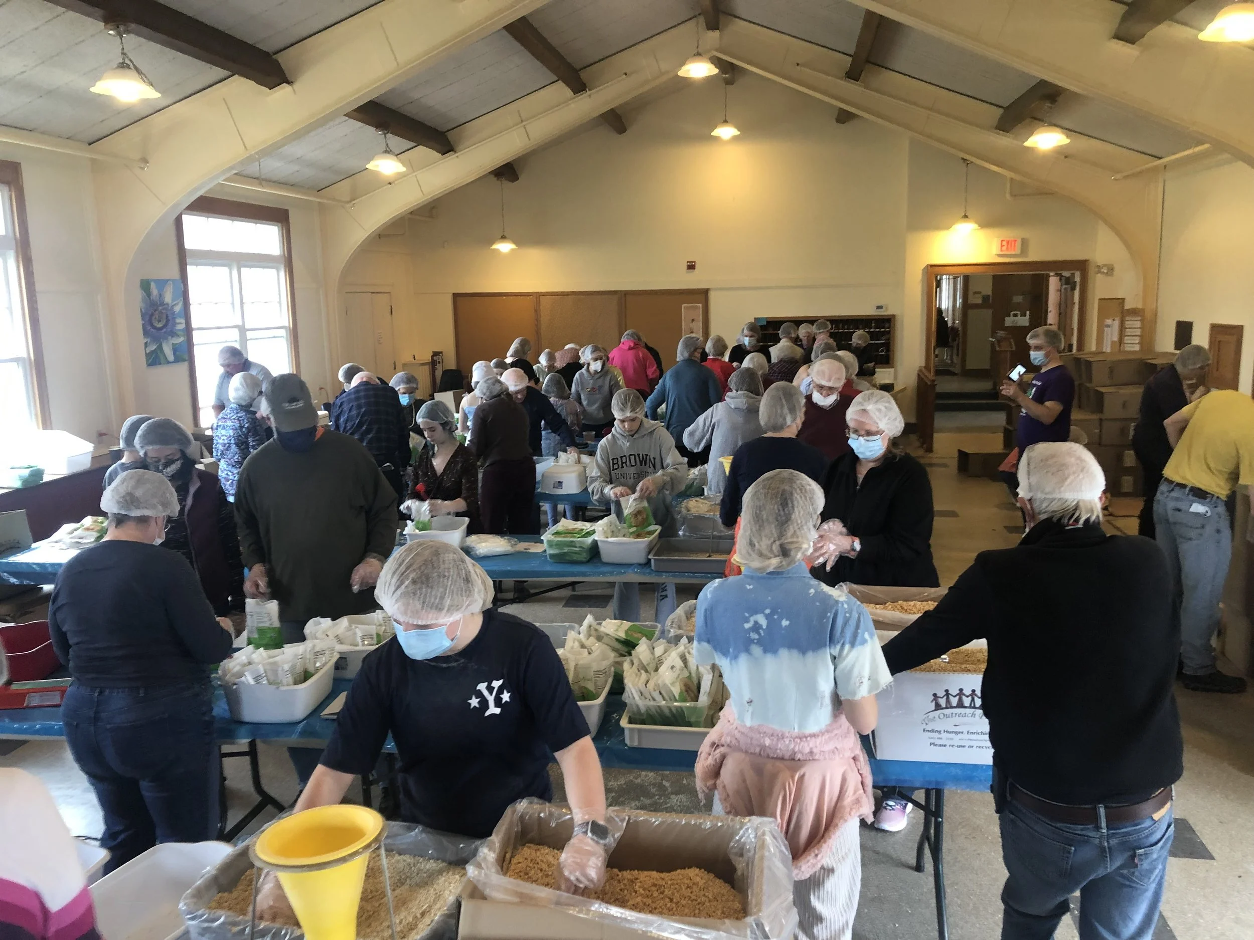 Trinity leads four churches in packing 30,000 meals for Ukraine