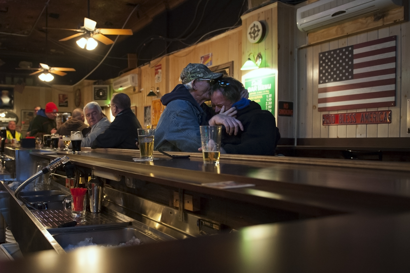  In a rare moment of levity, James Culleton and a friend share laughs at Roger’s Bar on 116th street in Rockaway, NY.&nbsp; They affectionately refer to this bar as their “Club Med.” February 7, 2013.&nbsp;    