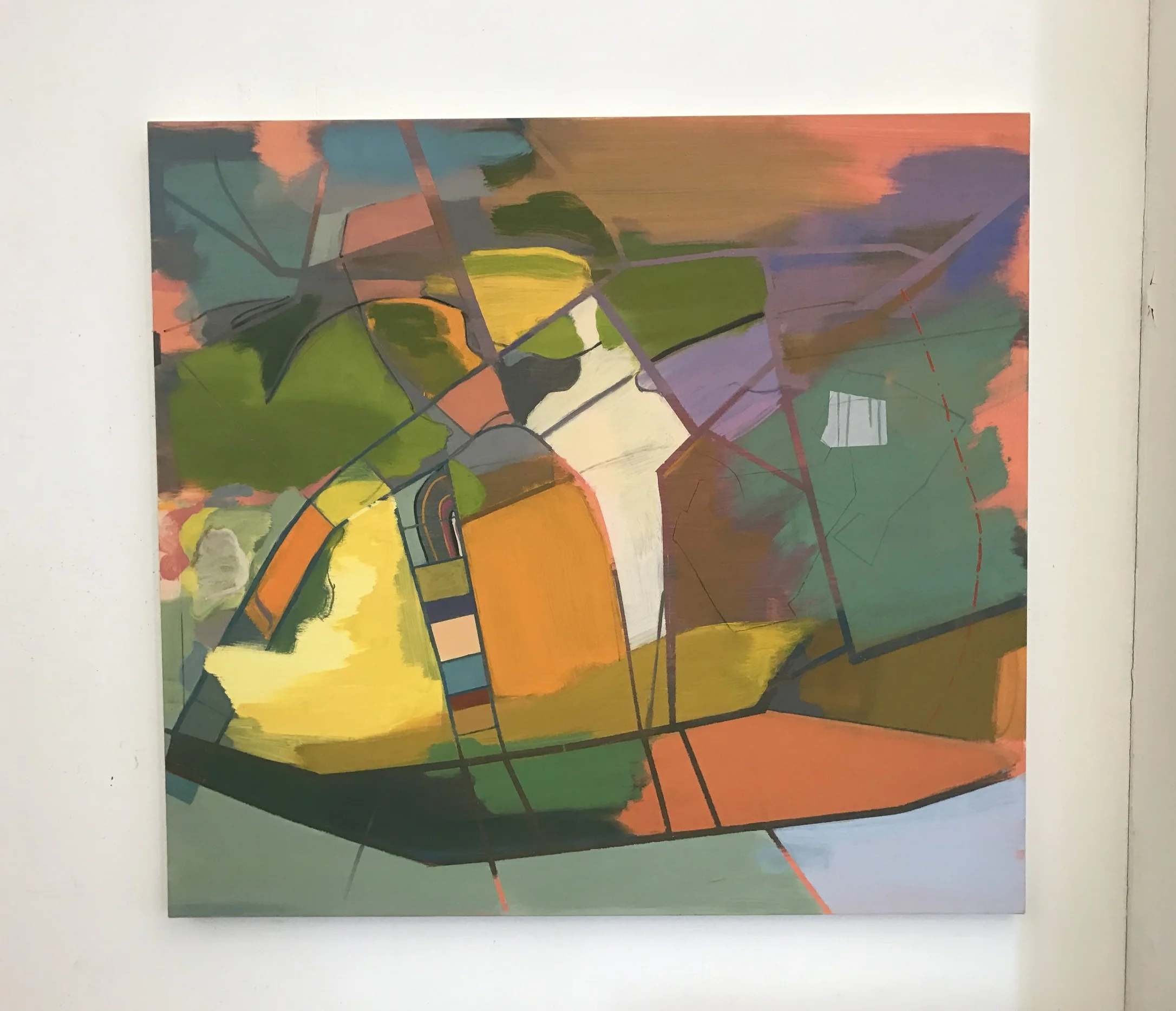 A painting using an old city map of Manhattan by Elizabeth Hazen hangs in her studio. 
