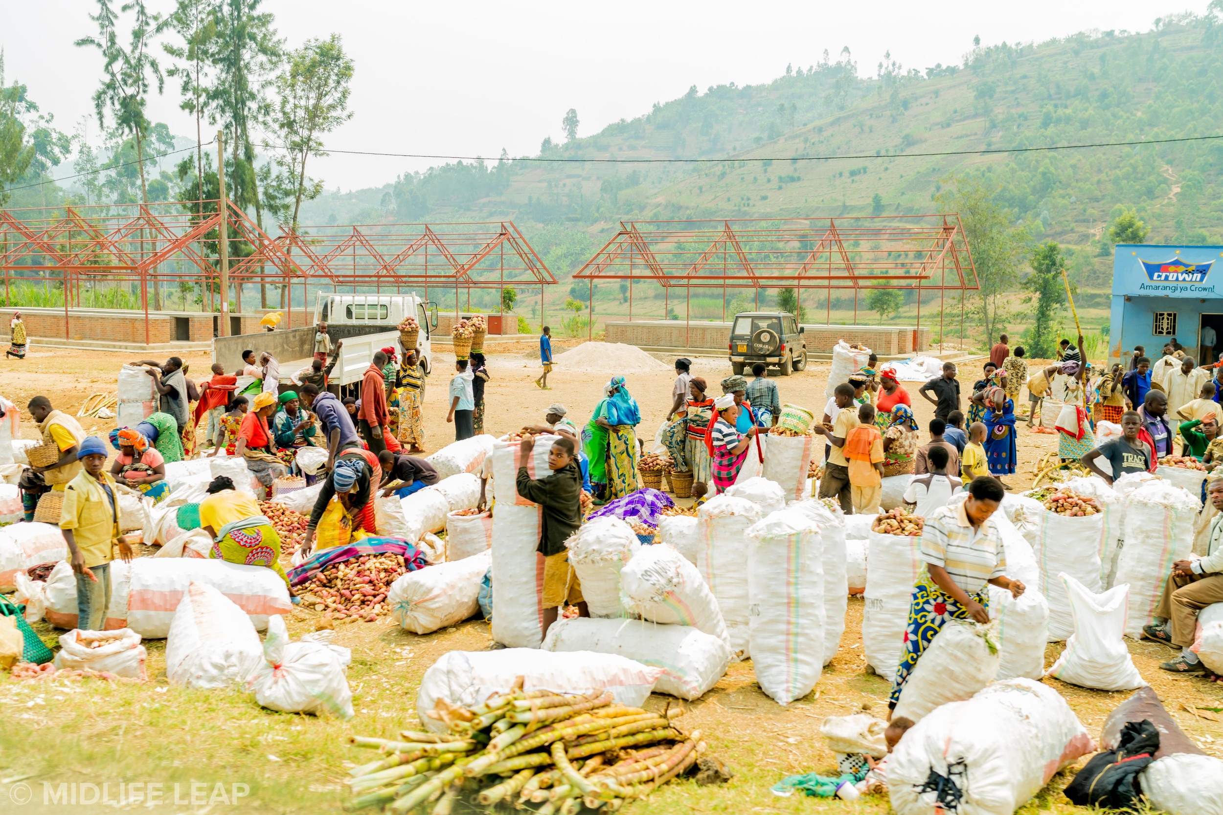Local farmers selling Irish potatoes and sugar cane.