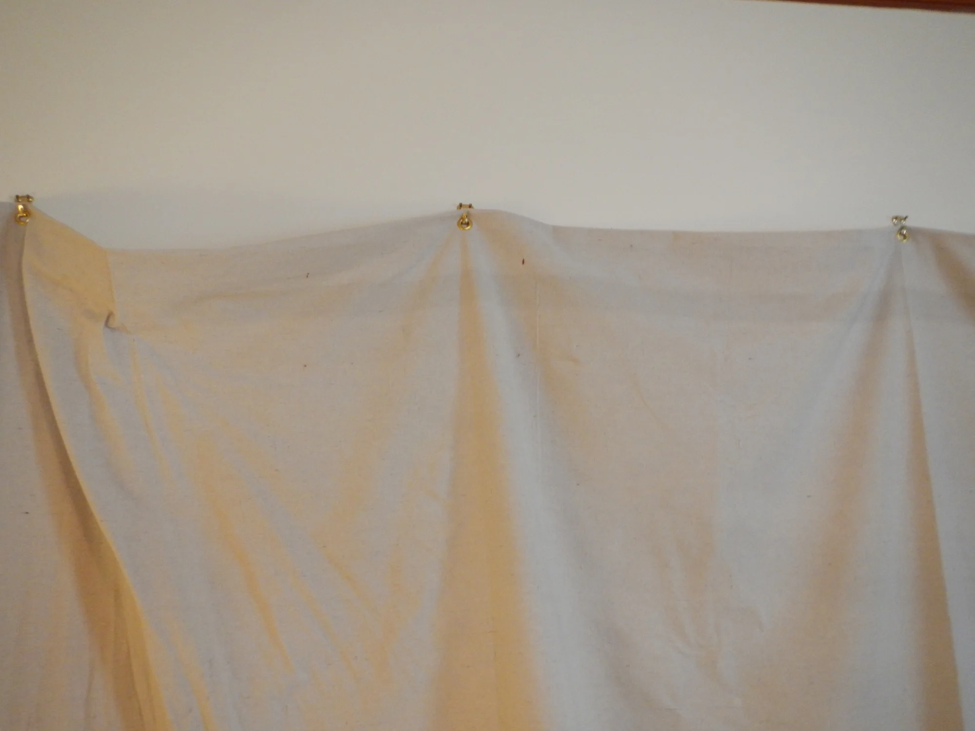 In this case I was covering an 8' wall, so I hung 5 hooks with 24" between each one.