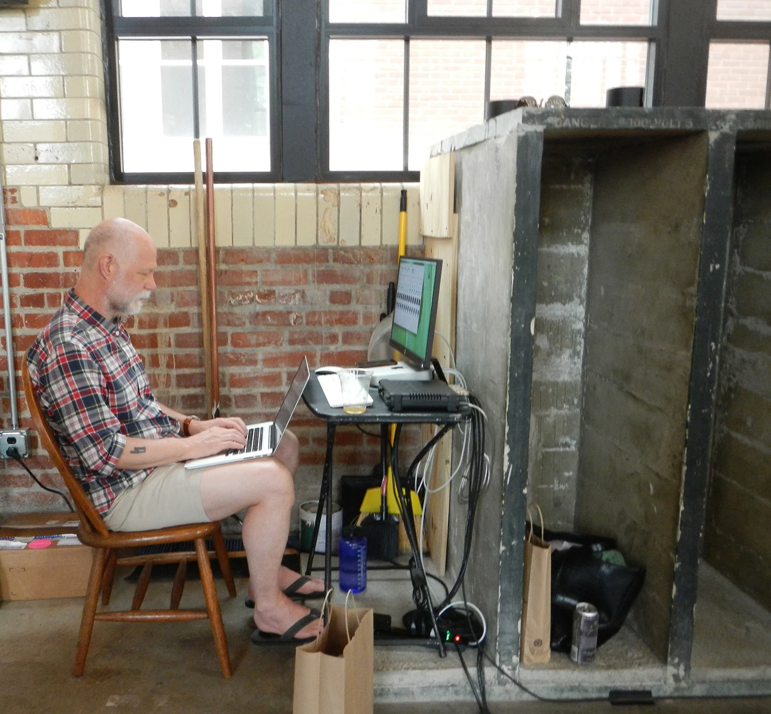 Steve working his magic beside old concrete casings that used to house electrical equipment for the substation