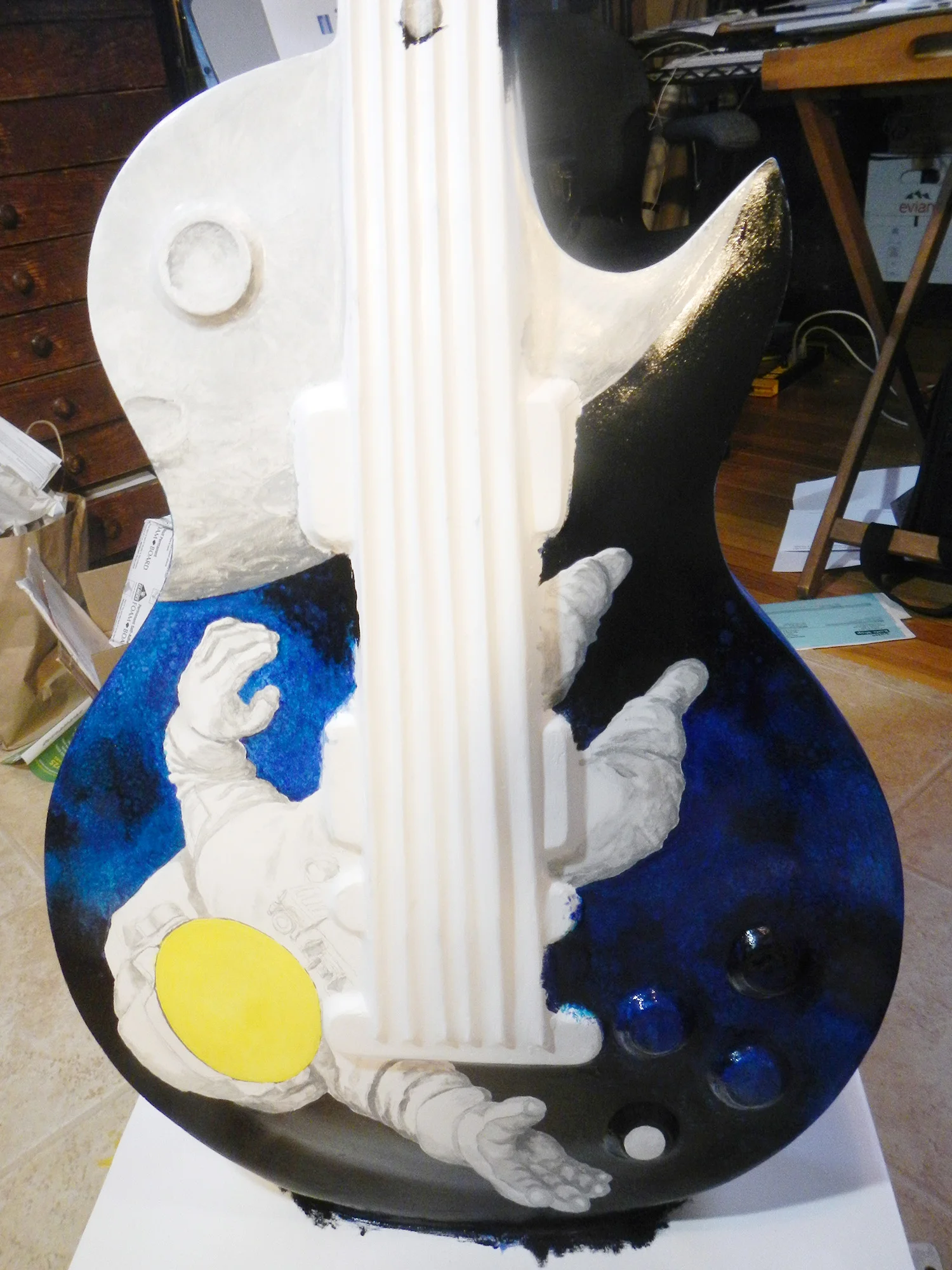 After two more coats of blue for the Milky Way, I started to paint in the blackness of space.