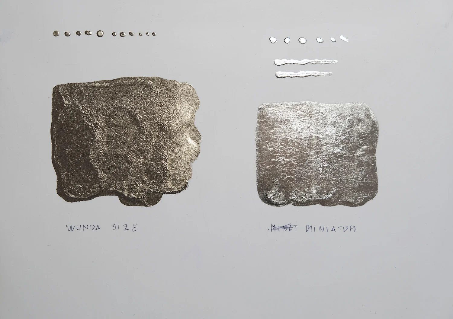 Two samples on my own acrylic skin that I brought with me: moon gold on the left and 12 karat white gold on the right.