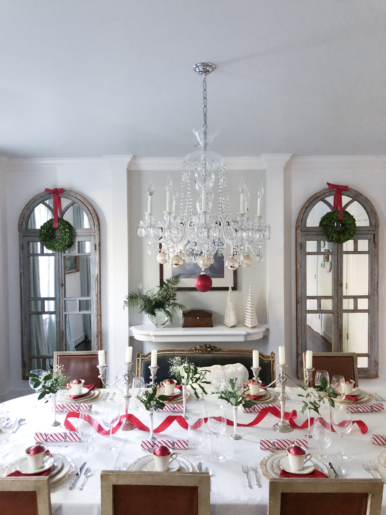 Traditional sterling silver candle sticks and Juliska glasses that beg to be filled and used for holiday toasts brighten up the table even more, while delicate sterling silver bud vases bursting with holly, berries, and baby’s breath integrate the season’s colors and add natural vibrancy.