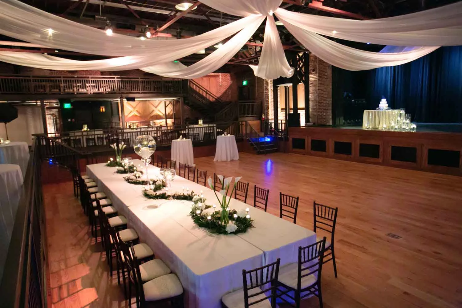 Draping above at Iron City contributed to an organic and breezy atmosphere for Allison and Blake. Photo: Nicole Muro