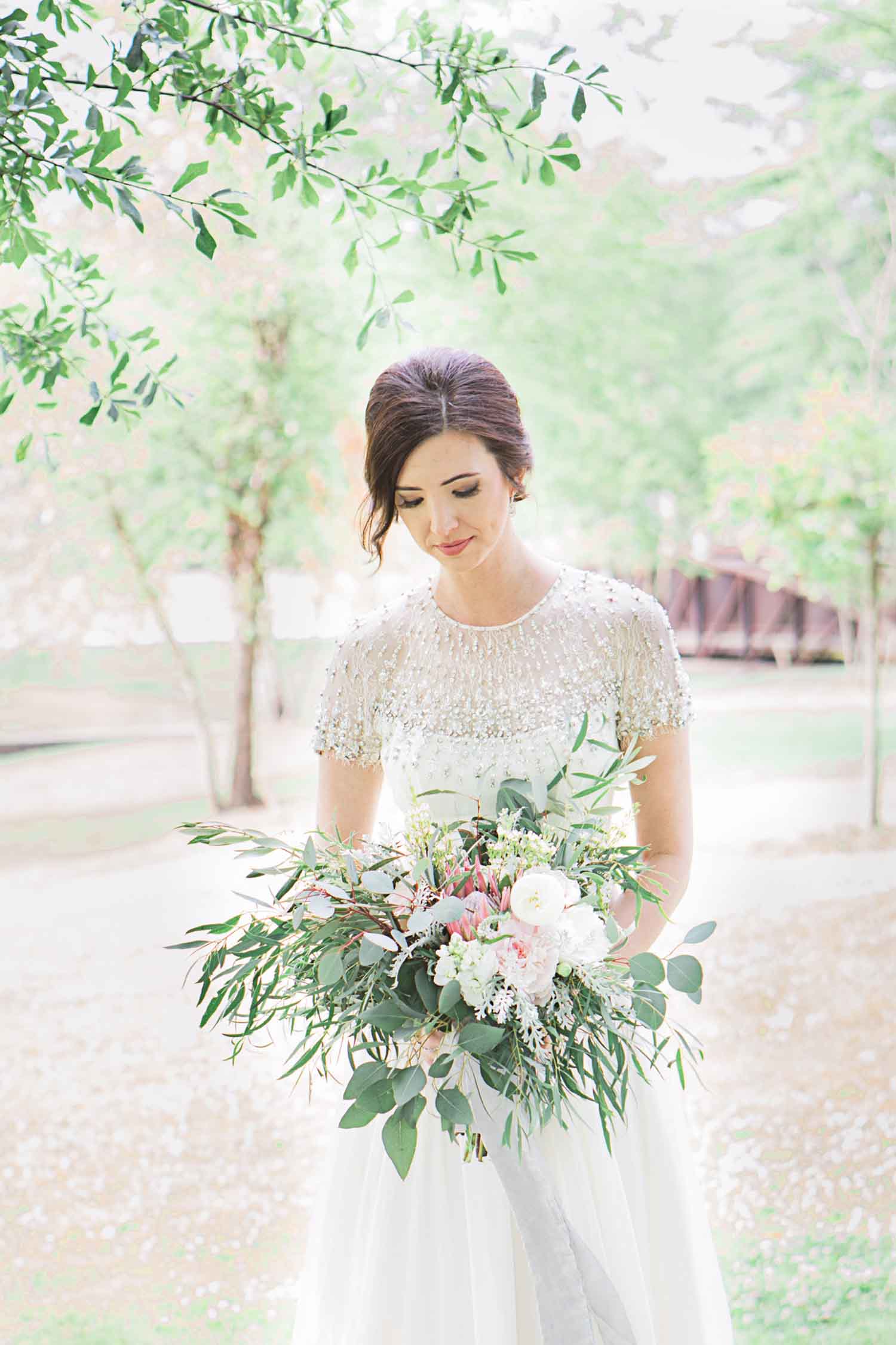 Brittany's bouquet, styled by Suzanne Martensen at Stems and Styles, includes greenery and an asymmetrical look emblematic of the growing trend toward organic and natural at weddings. Photo: Angela Karen