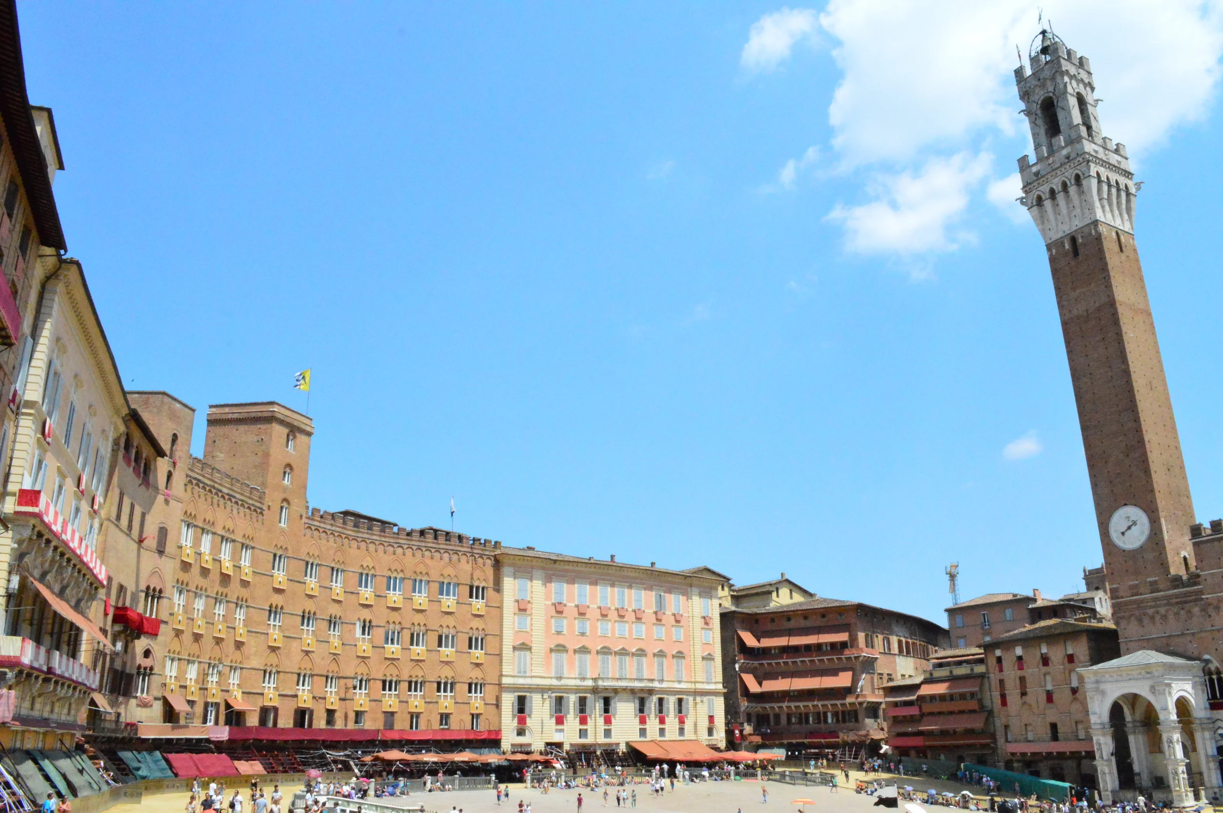  Every year in early July, the entire town of Sienna, Italy comes out for the Palio, a high speed horse race around this town square. The audience &nbsp;-decked out in Medieval garb- is both in the outer and inner ring in incredible suspense of which