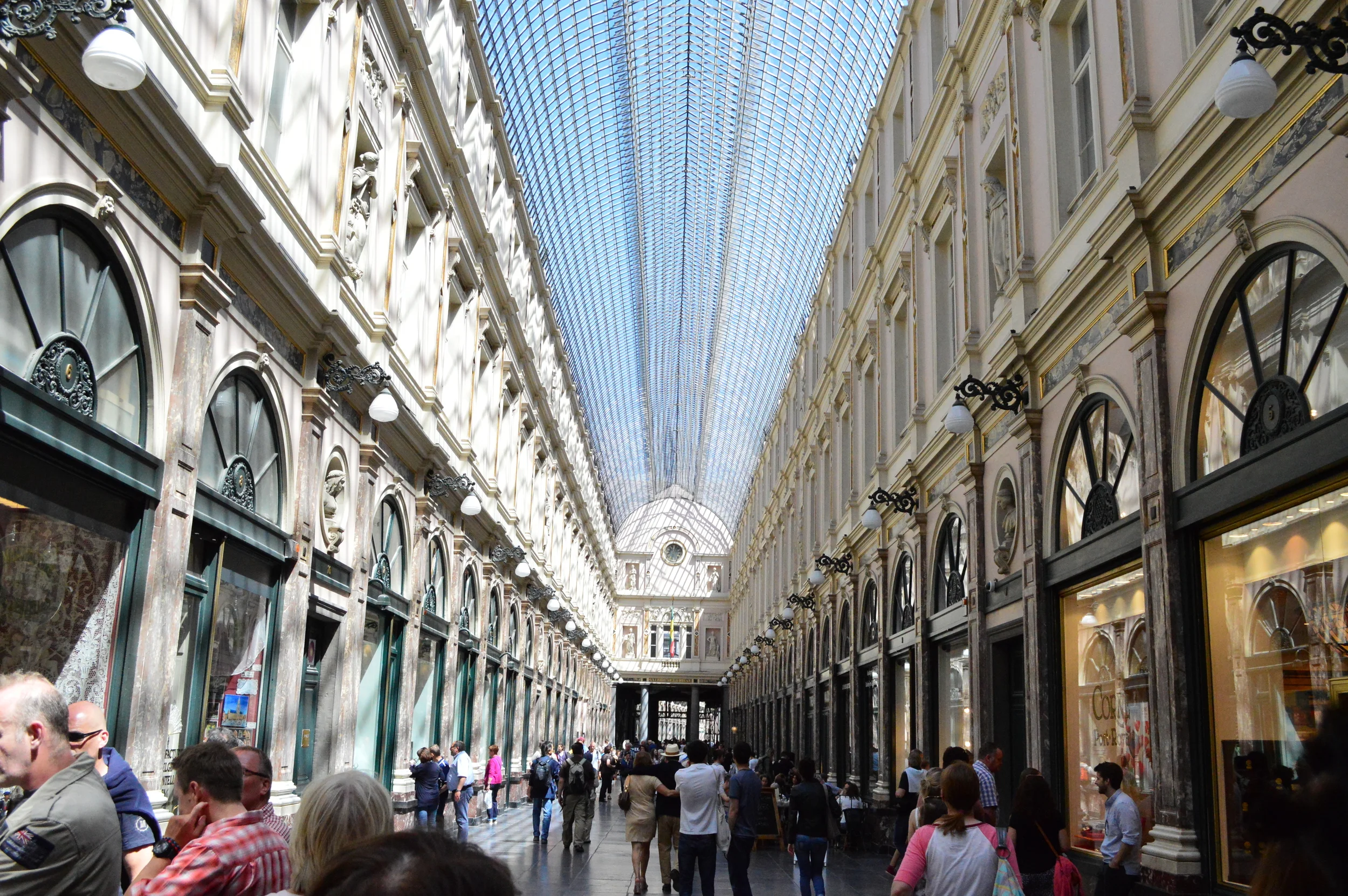  Pop into  La Galerie de la Reine  (the Queen's Gallery) for some name brand shopping and stunning chocolate stores. Brussels welcomes you!  One of my favorite chocolate shops is tucked in here behind stunning glass windows of decadent displays. My o