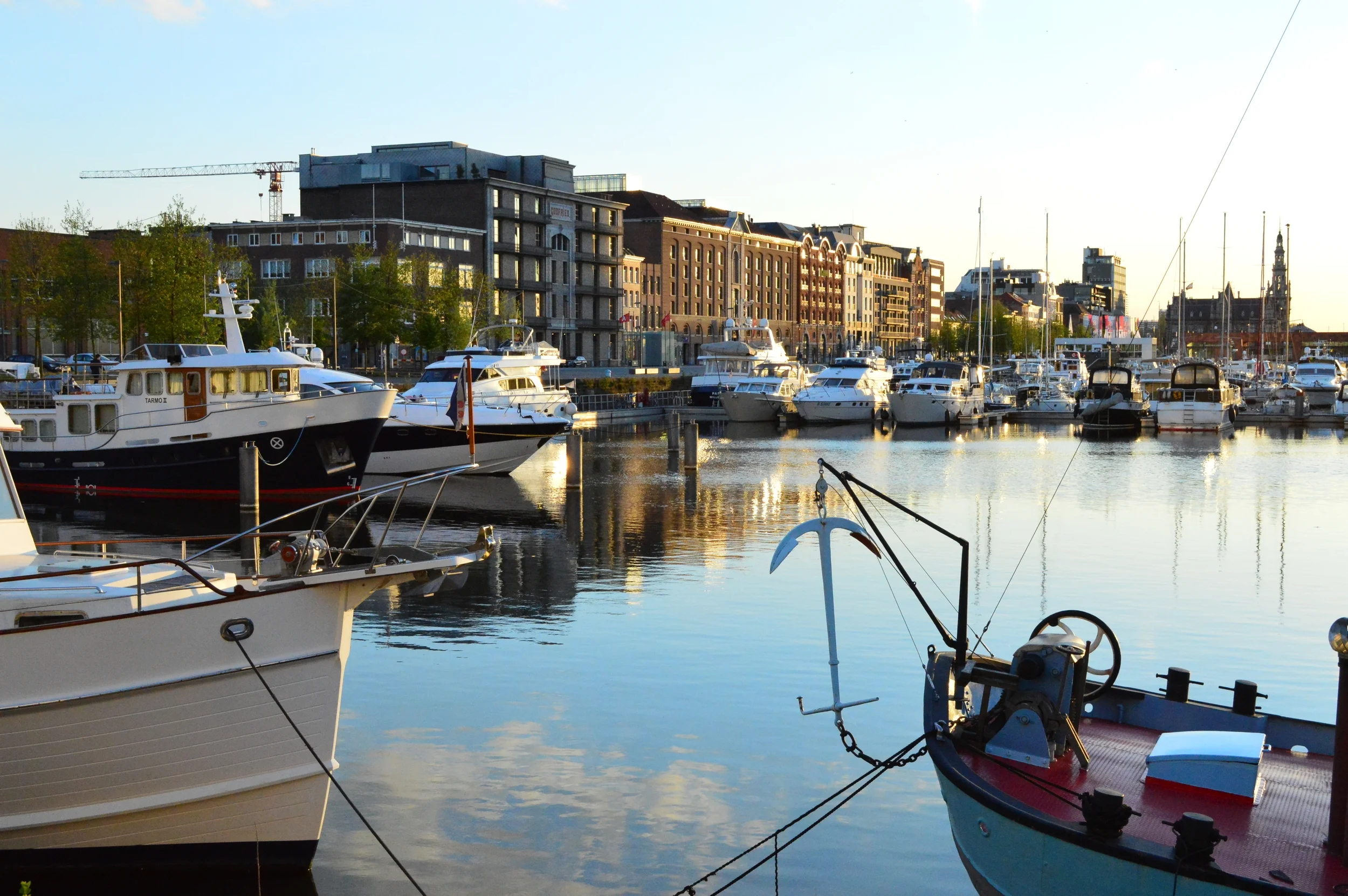  This harbor is home to me as I lived here in Antwerp, Belgium. Grab a picnic or head to the local cafés nearby for an excellent beer, great cuisine and a stunning view of the sunshine on the yachts.  The best place? "Bar du Port"&nbsp;on the corner 
