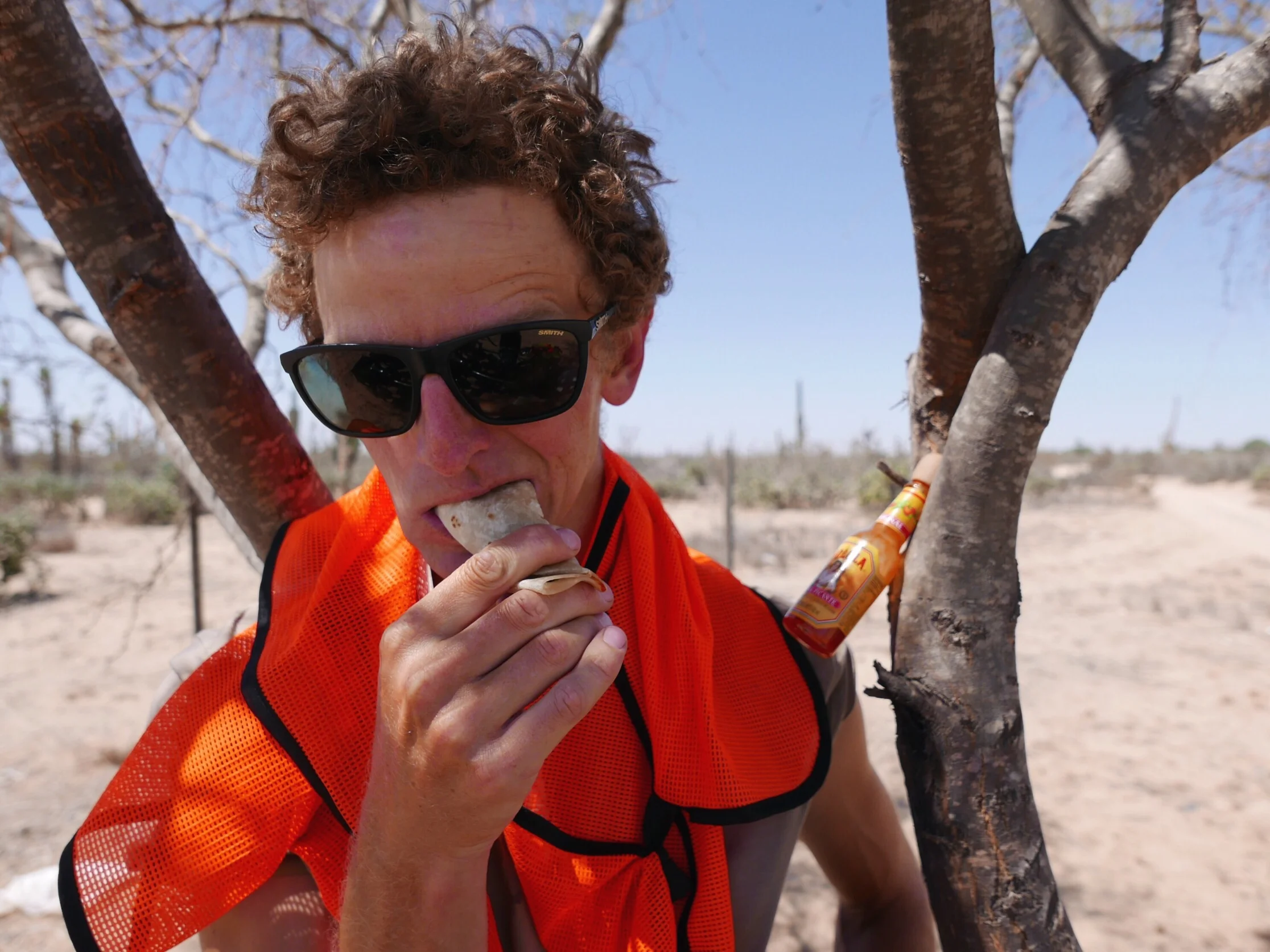 A man is never too far from his hot sauce.