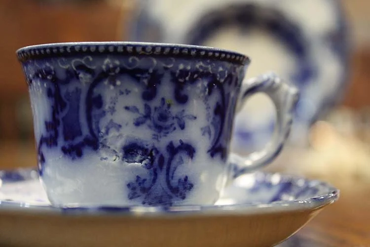 "Flow Blue" are white and blue china pieces where the blue glaze bled, or "flowed" during the firing process.