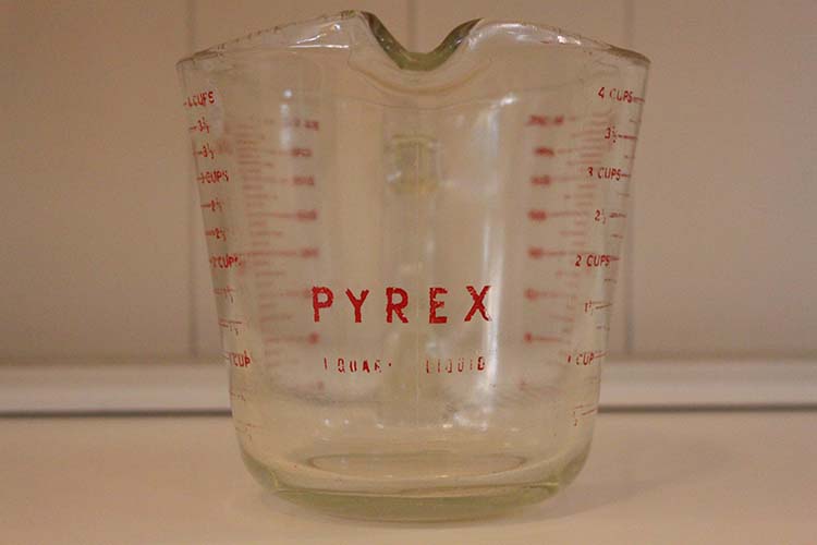 The first generation of PYREX kitchenware was made using borosilicate glass which has a unique blue-ish-green tint. Today's clear PYREX is made using a very similar material and will also have this tint.