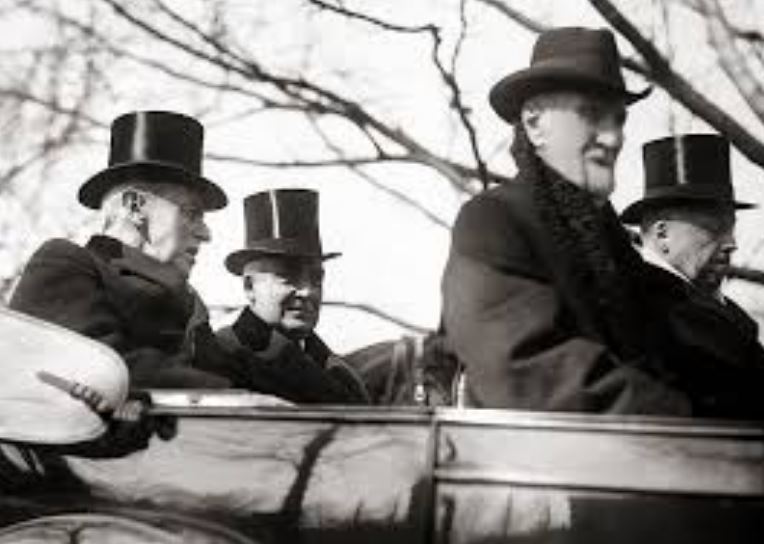  Warren G. Harding wearing a top hat, traveling to his inauguration. 