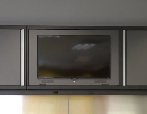TELEVISION CABINET - If you spend a lot of time in your garage, it will be important to not miss the big game. We offer flatscreen TV cabinets.