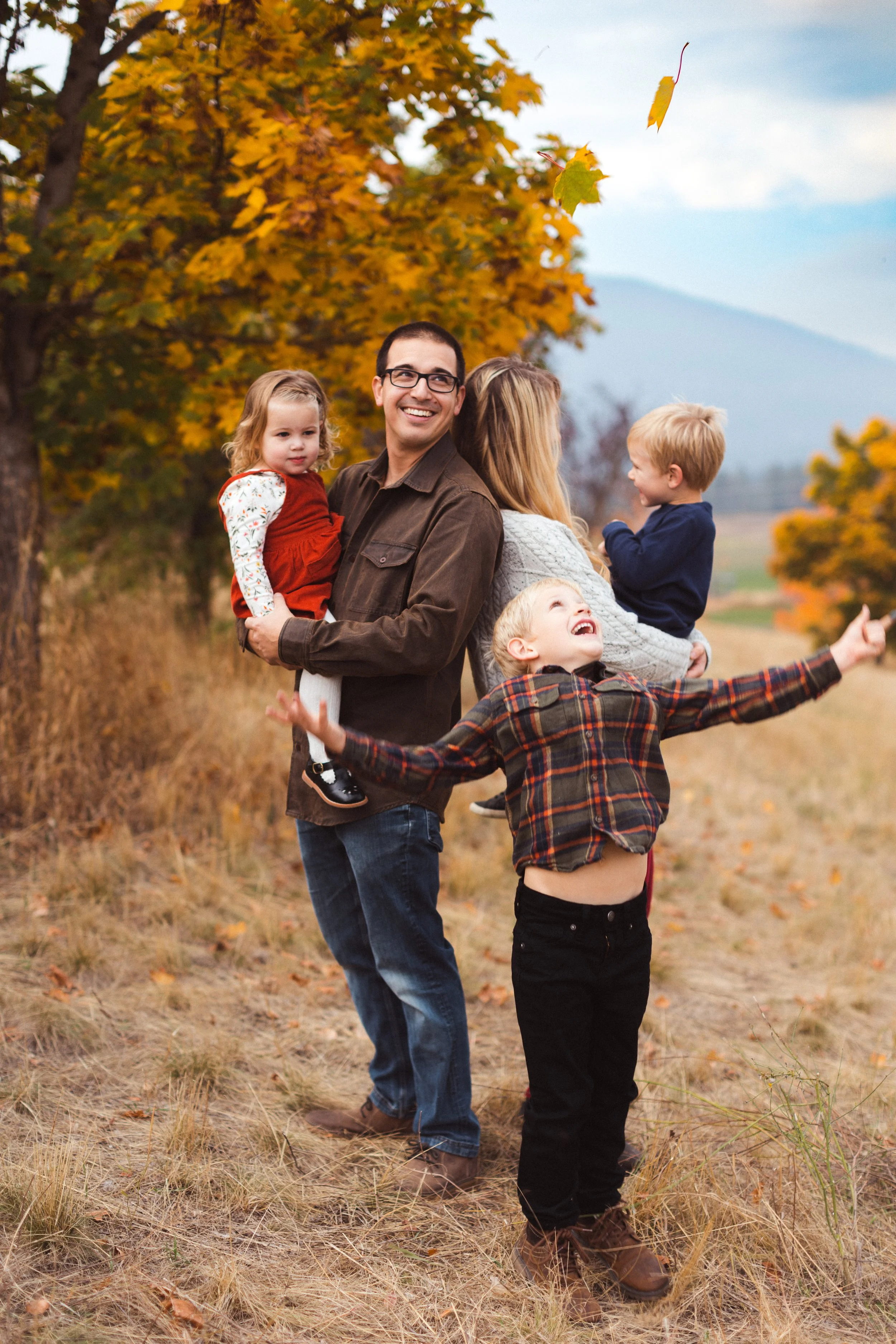Family playing in leaves fall family session in Rathdrum, Idaho