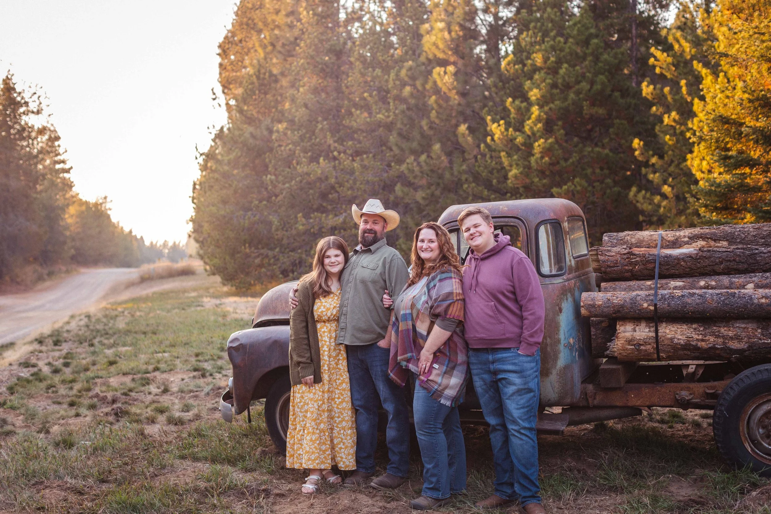 Autumn Delight: Extended Family Photoshoot with Golden Trees, Pumpkins, and an Old Truck