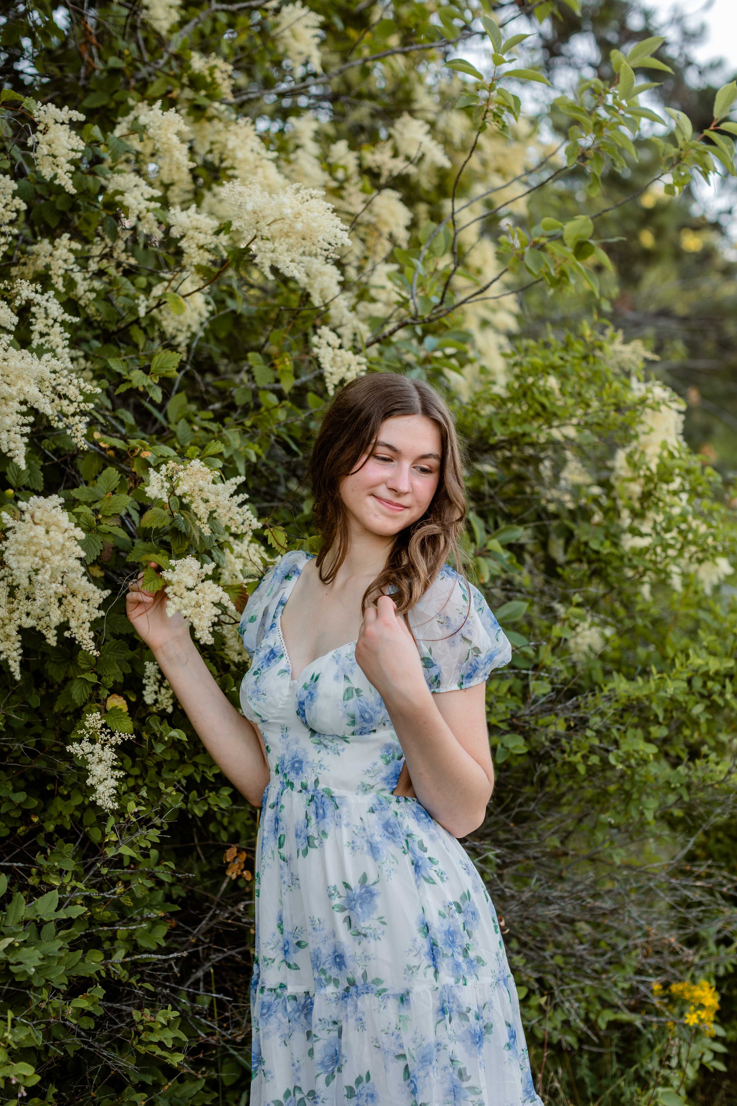 Senior session portrait with wildflower at Farragut State Park