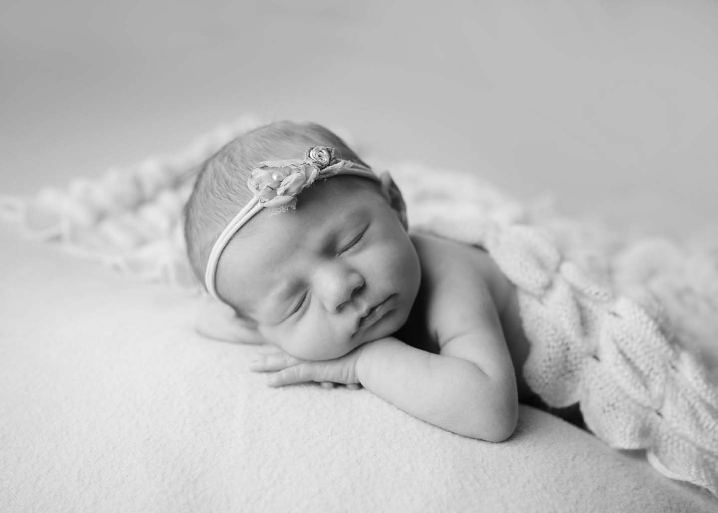 newborn session posed sleeping in studio coeur d'alene black and white