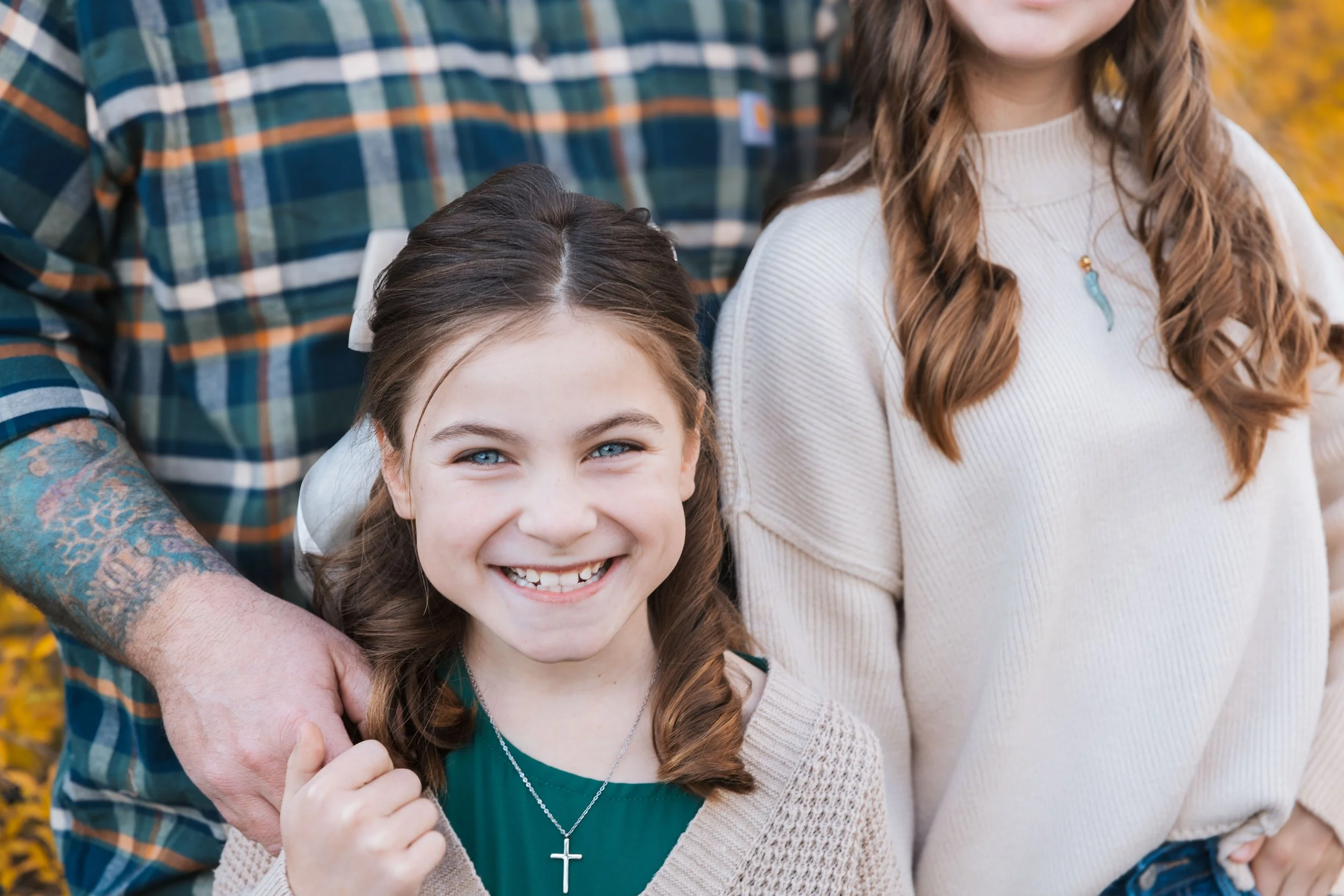 YoungGirlSmilingWithFamily