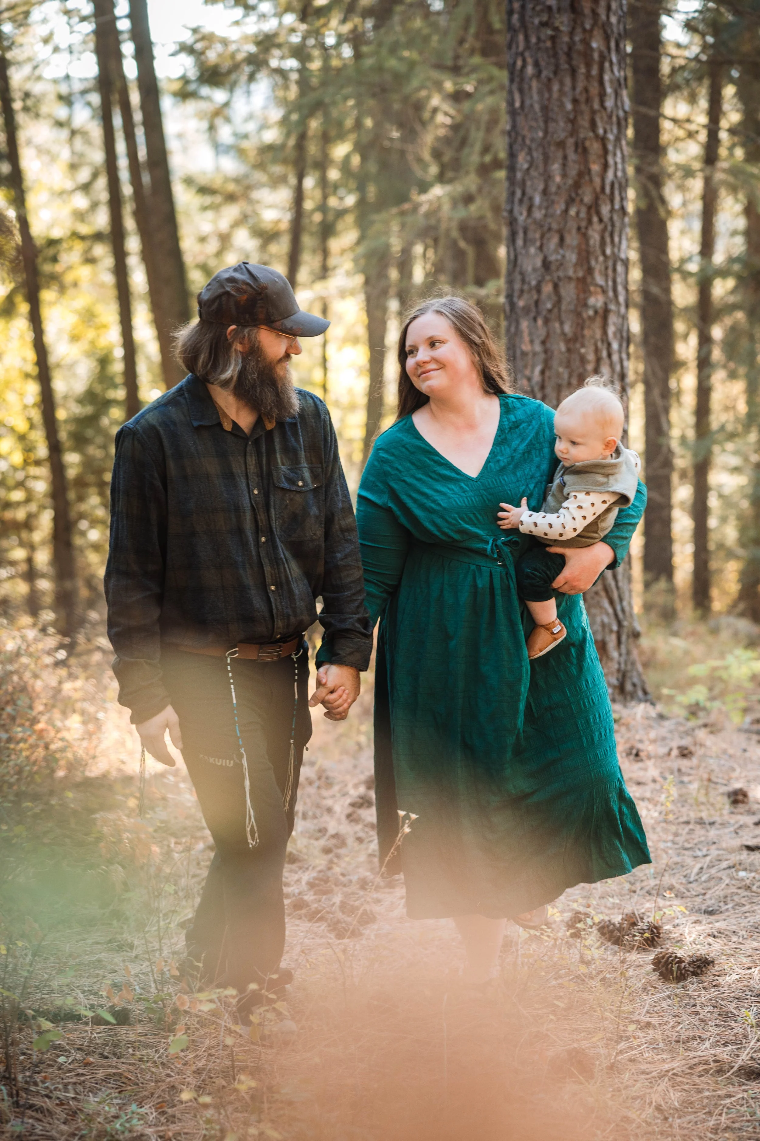Family walking together during a fall family session in North Idaho
