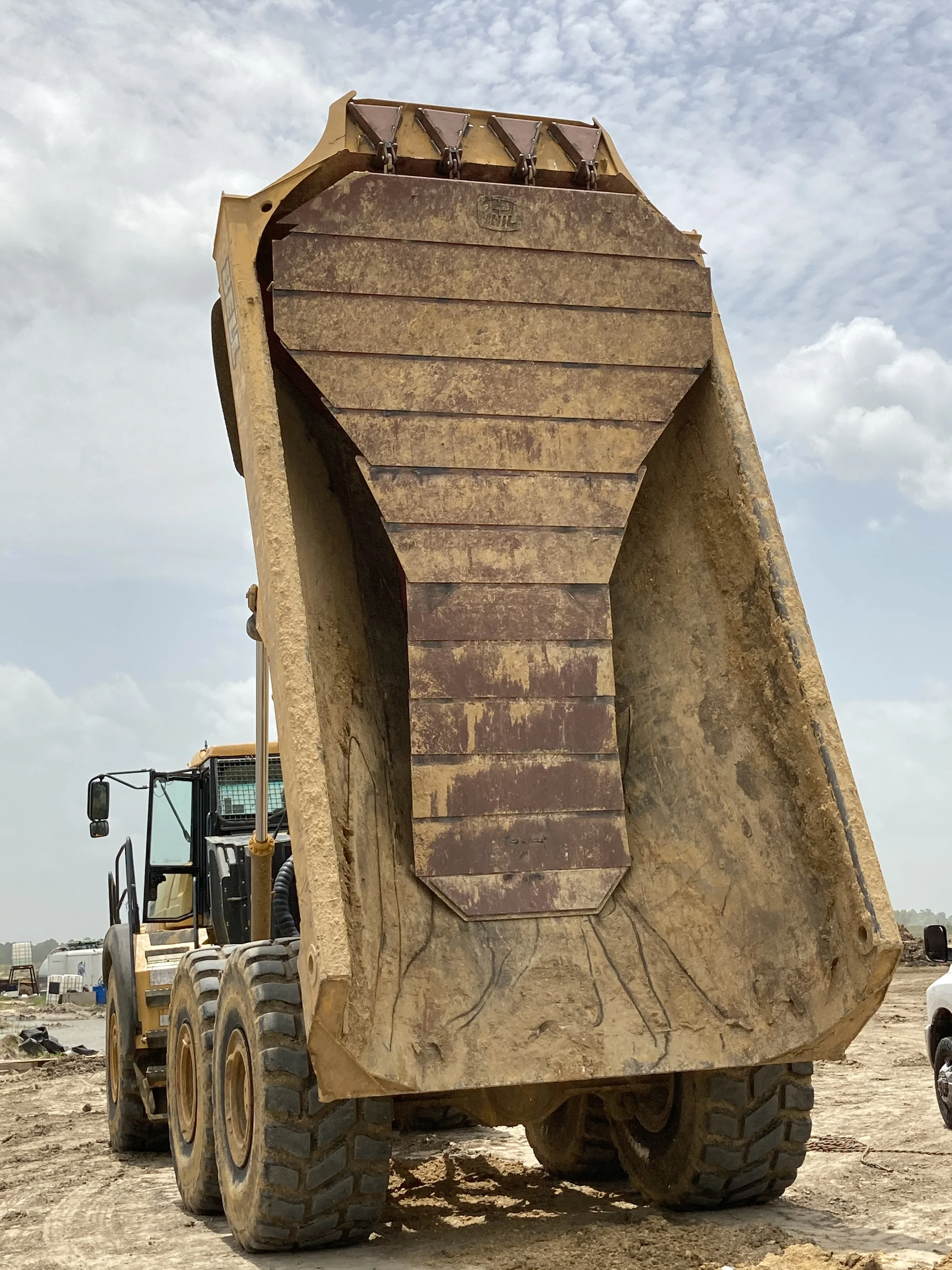 Load Ejector System Addresses Material Carryback for Improved Haul Truck Efficiency