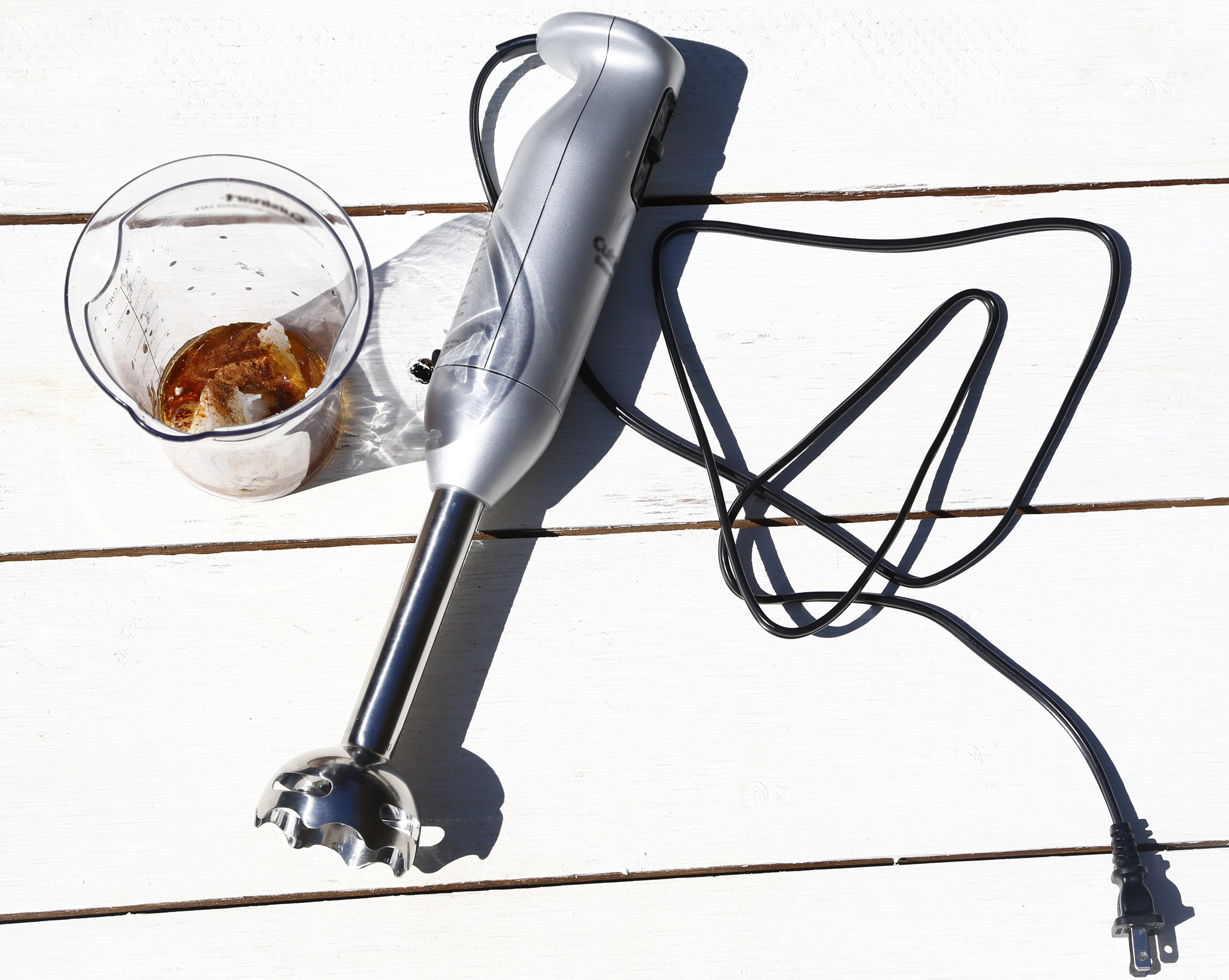 Immersion Blender with immersion cup filled with organic honey, coconut oil, and pumpkin spice.