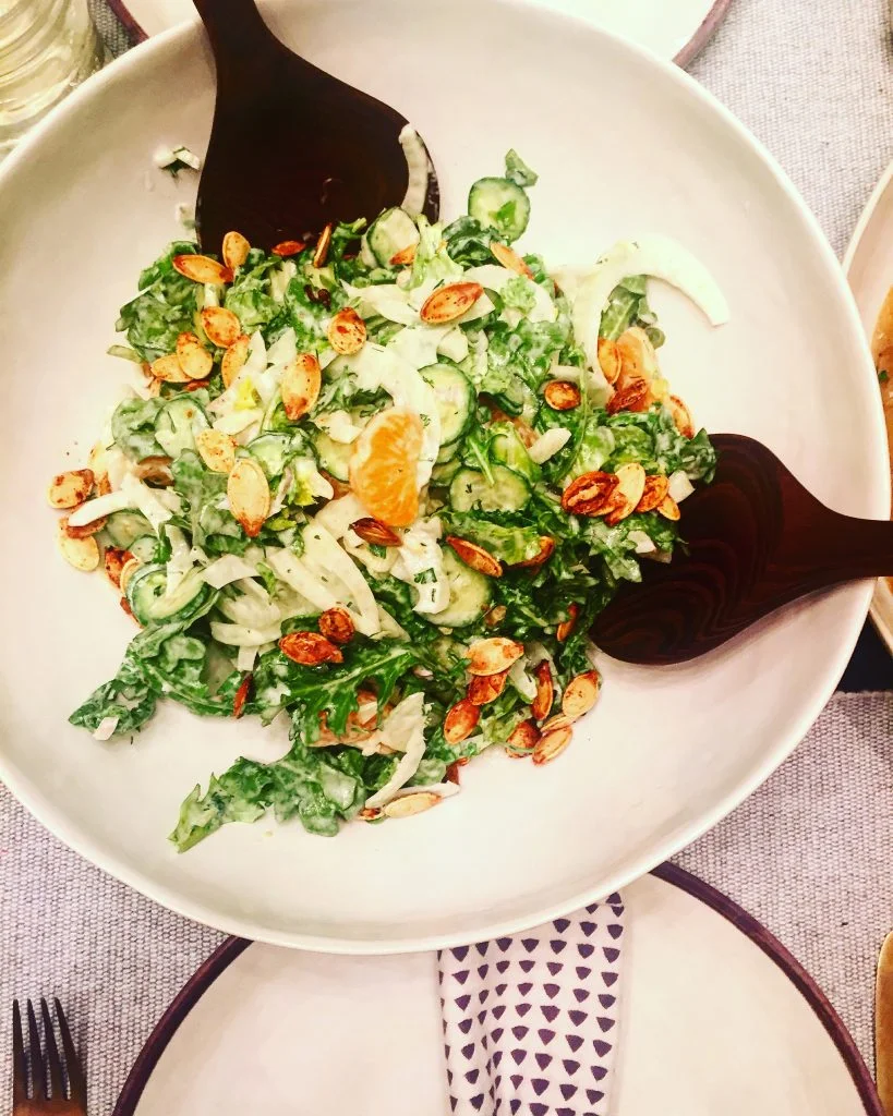 Arugula, fennel bulb, clementines in a herb yogurt lemon dressing, garnished with the pumpkin seeds we roasted today.