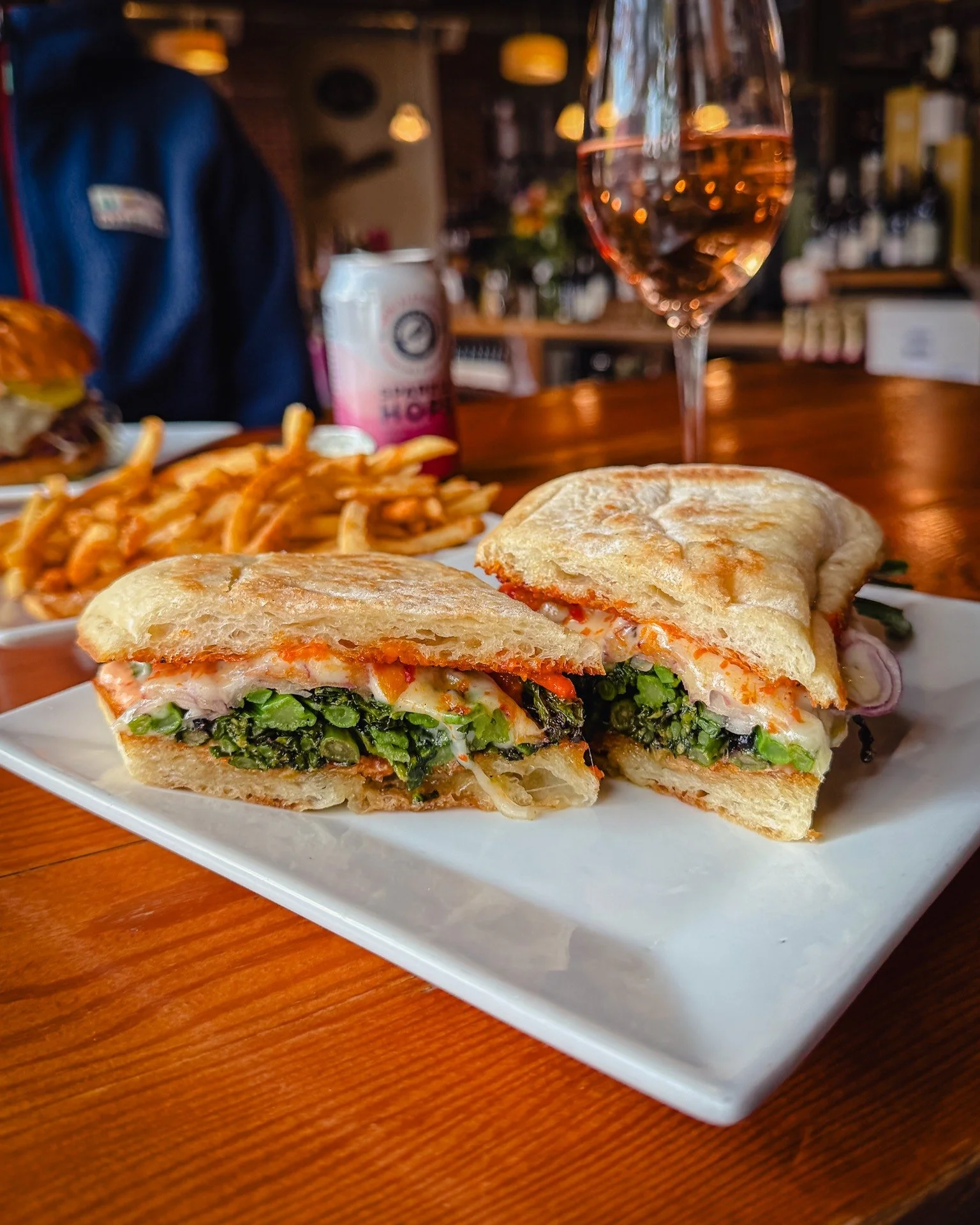 Roasted veg sandwich, crispy fries, and a glass of ros&eacute;.
Solid Tuesday choice.