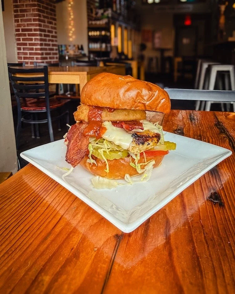 The Western BBQ Bacon Chicken Sandwich is sticking around through the weekend. 

Grilled chicken, bacon, American cheese, fried onion ring, house-made BBQ sauce (gluten-free), lettuce, pickles, and tomatoes on a brioche bun.

Still messy. Still good.