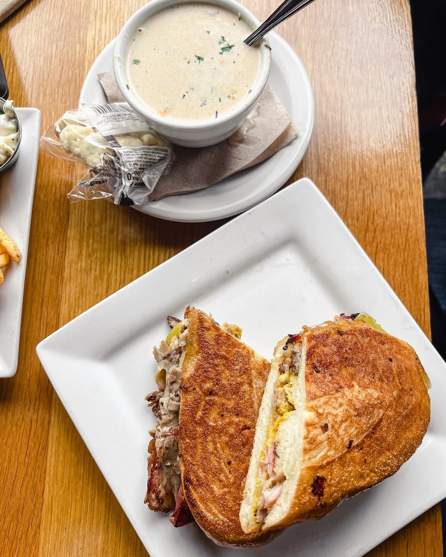 Cubano + clam chowder kind of day.

Pressed Cubano stacked with roasted pork, ham, swiss, pickles, and mustard on a toasted roll.

Add a cup of our clam chowder (in the soup pot right now) and you&rsquo;re set.