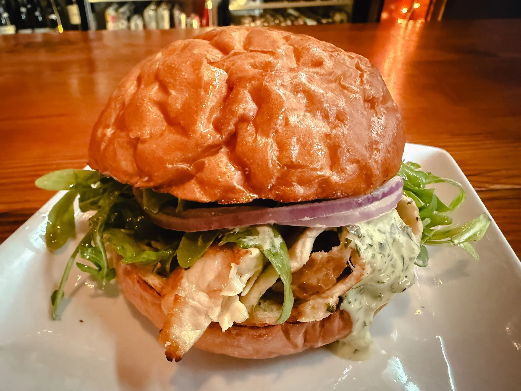 This week&rsquo;s special: roasted pork.

Stacked on a brioche bun with gremolata mayo, dressed arugula, and red onion&mdash;bright, a little herby, and really good.