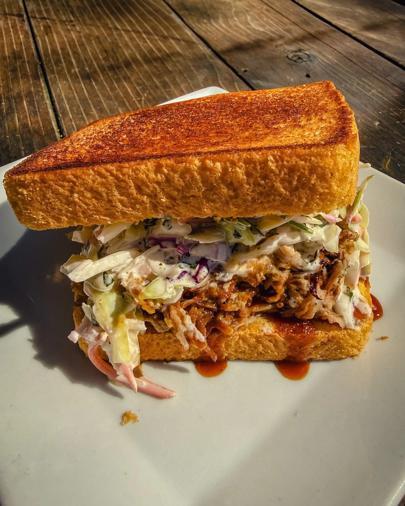 New weekly special is here! Citrus-braised pork shoulder, piled high on Texas toast.

A little tang, a little smoke, a little messy in the best way.
Topped with house slaw and BBQ sauce to bring it all together.

Grab one, maybe some fries, and call 