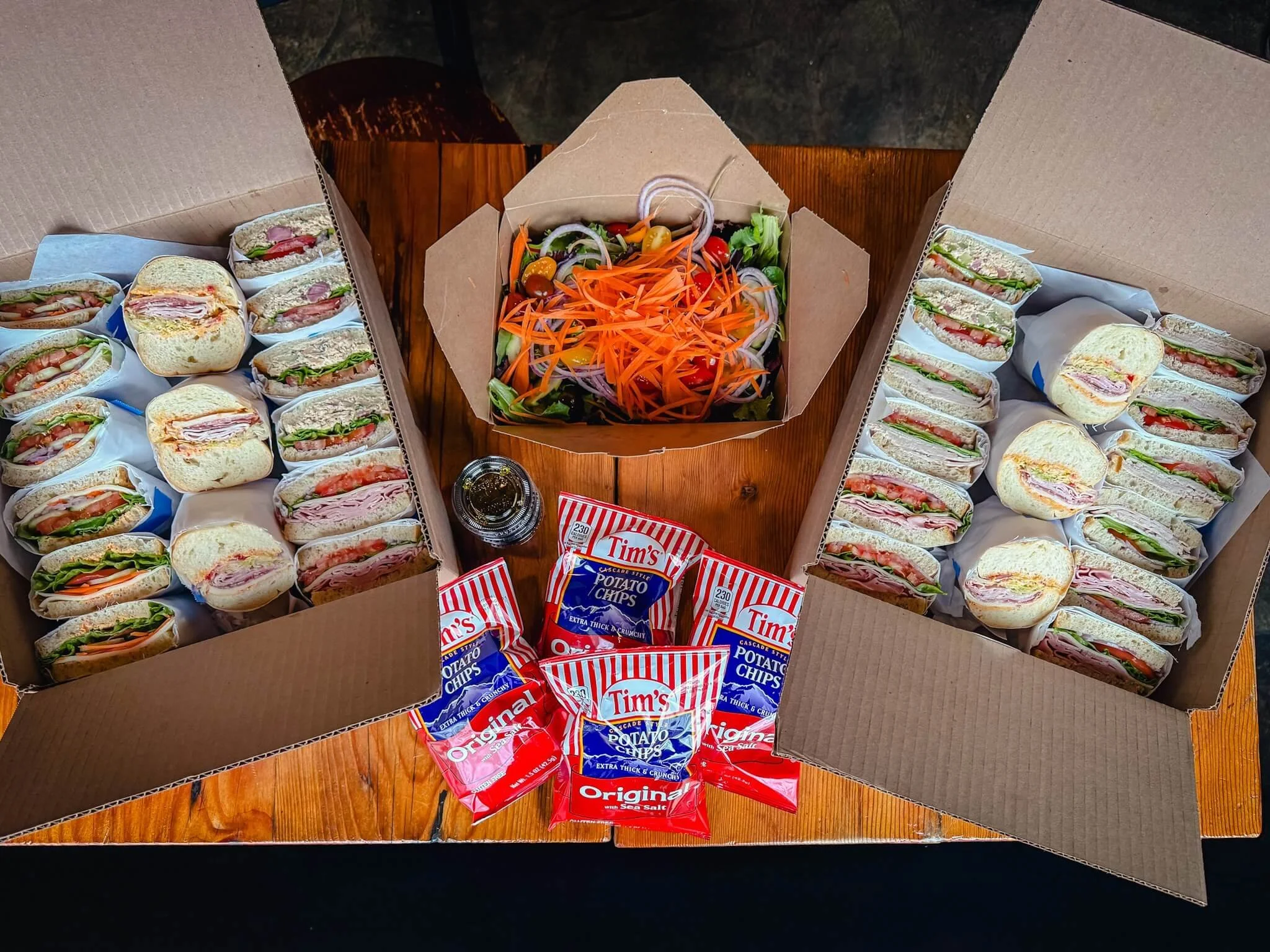 Catering boxes are here 🥪

Feeding a group just got easier.

Mix and match your sandwiches, add chips or a salad, and choose your pickup time. We&rsquo;ll have everything ready when you get here.

Small, medium, and large options. GF bread available