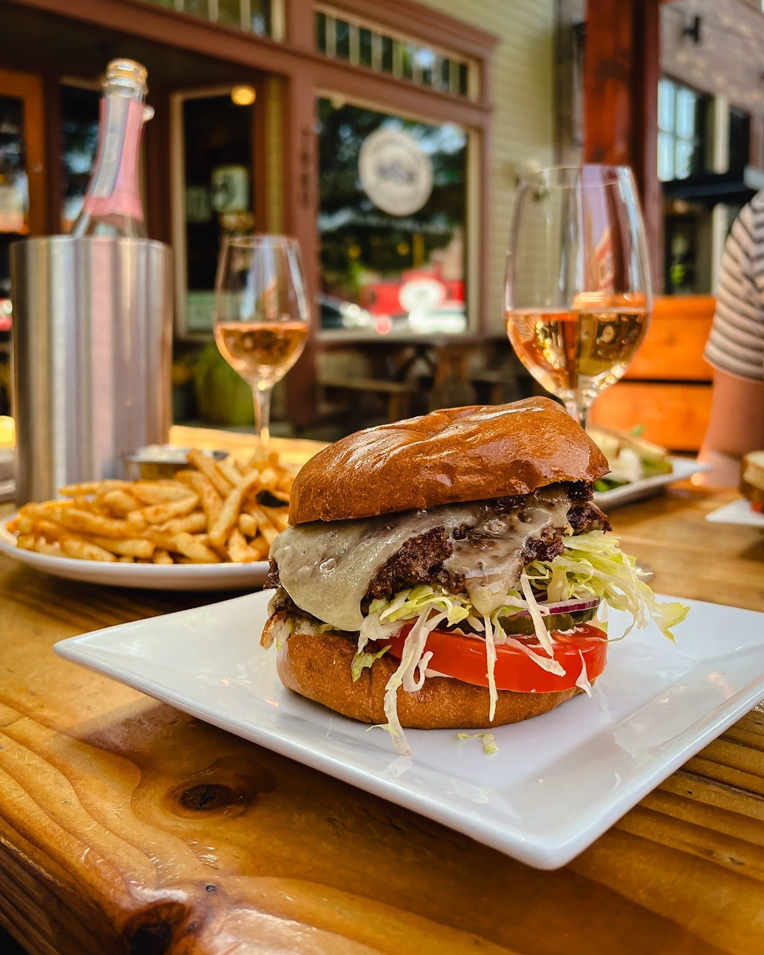 Warmer days ahead.

Smash burger, fries, and a bottle of ros&eacute; on the patio. Summer&rsquo;s getting close.