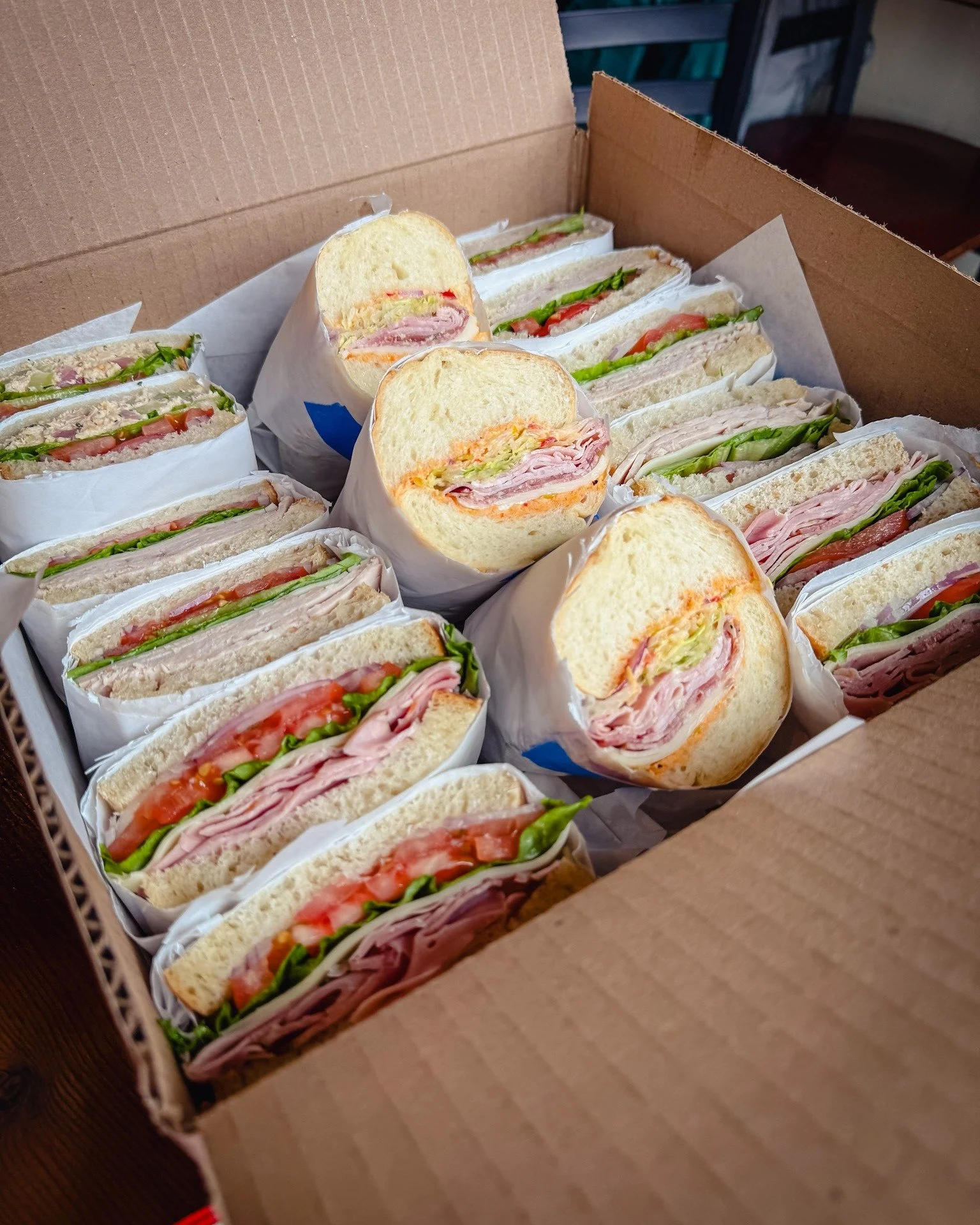 Group lunch sorted. Catering boxes with sandwiches built to order, chips, salad add-ons, and GF options. Order online by noon the day before. Order online at pdxbottleshop.com/catering.