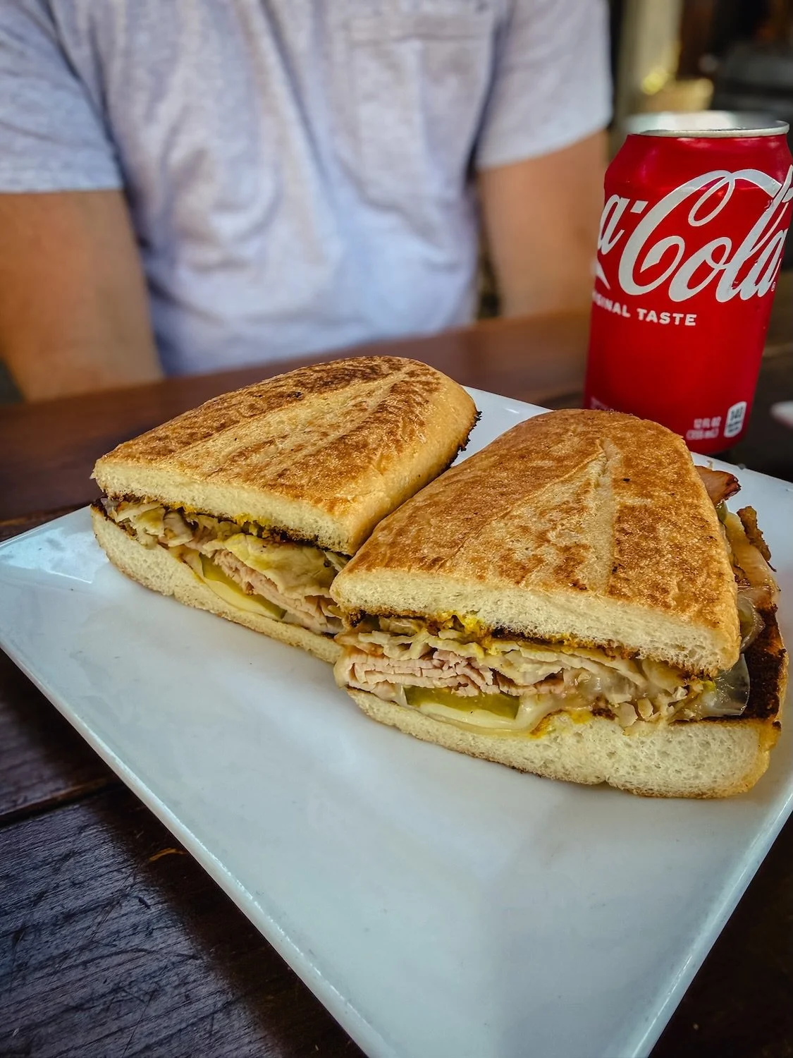 The Cubano 🥪

House-roasted pork, smoked ham, swiss cheese, pickles and yellow mustard, all pressed together on a grilled roll.

Get it on our classic roll or on gluten free bread. Same toasty goodness either way.

Grab one for lunch, pair it with a