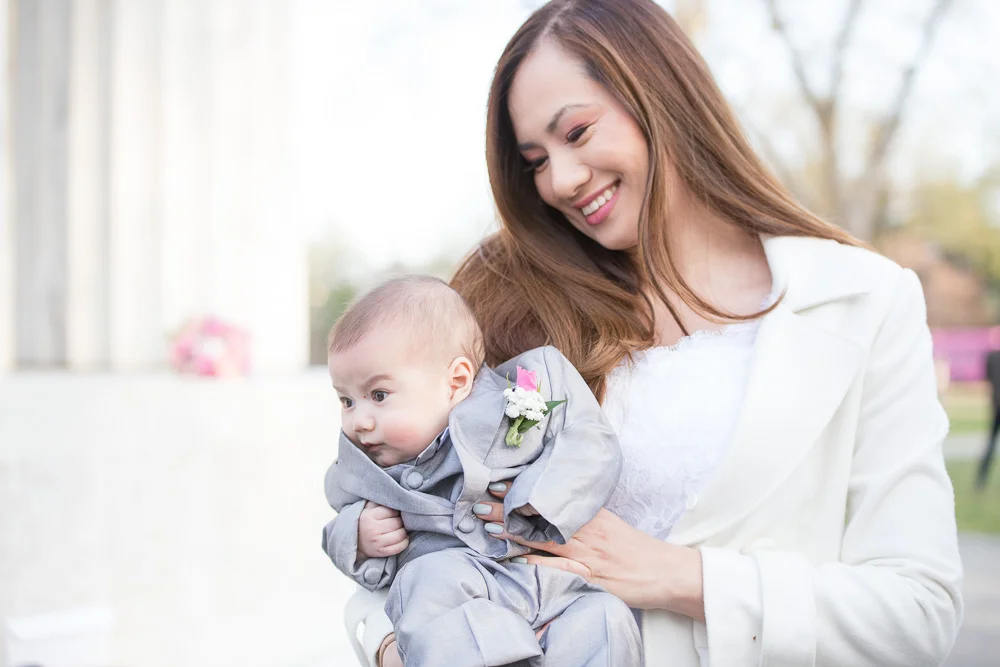 Adorable wedding day photo of bride and her son at the DC War Memorial | Megan Rei Photography | Photojournalistic wedding photography
