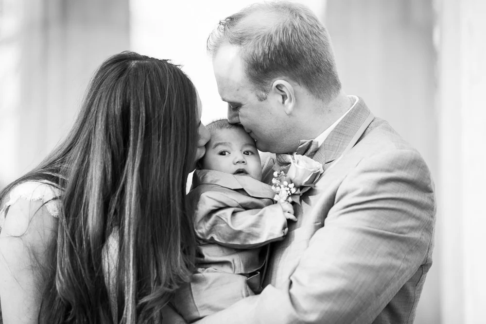 The happy wedding couple with their adorable son | Megan Rei Photography | Washington DC Wedding
