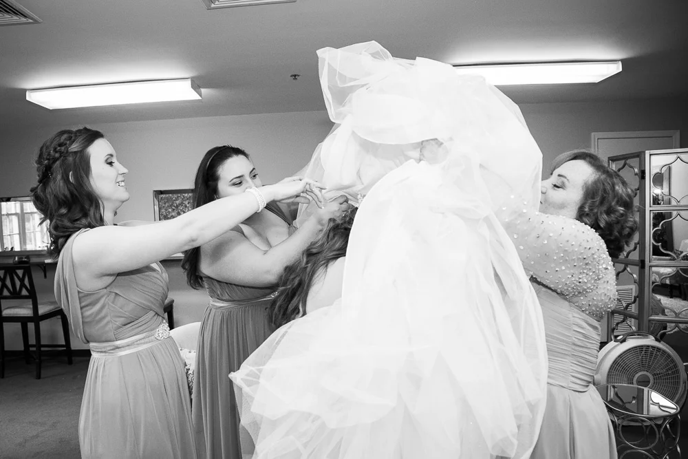 Putting on the wedding dress | Haymarket Virginia Wedding Photography
