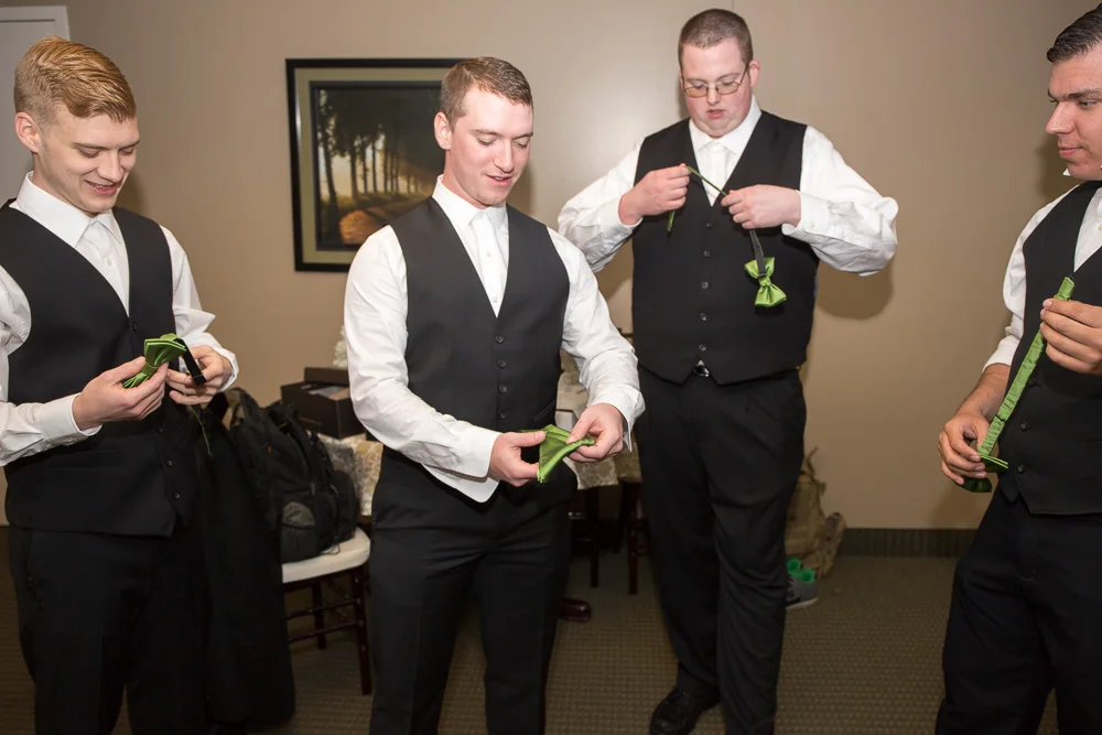 Groom and groomsmen getting ready for the wedding day