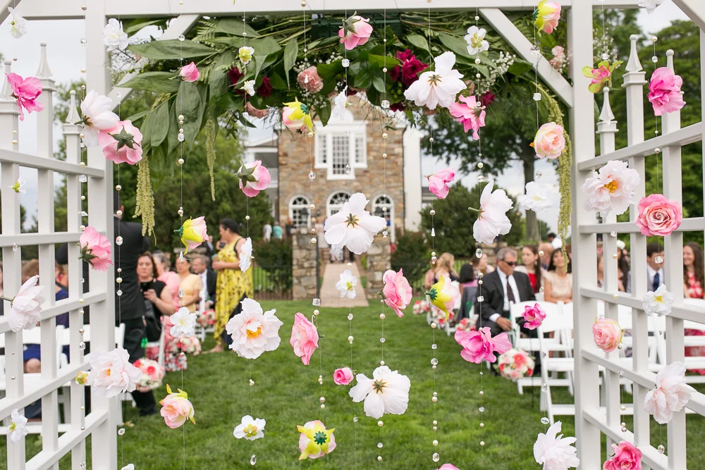 DIY flower curtain | Hanging floral backdrop for outdoor ceremony at Evergreen Country Club | Northern Virginia Wedding Photographer