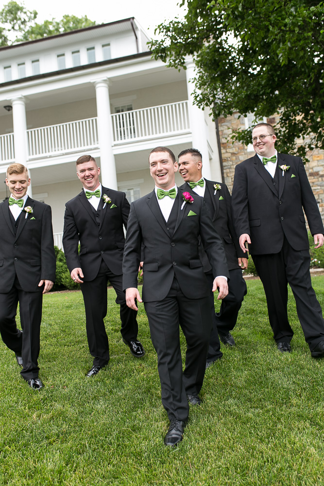 Groomsmen in front of the Inn at Evergreen | Candid wedding photography in Northern Virginia