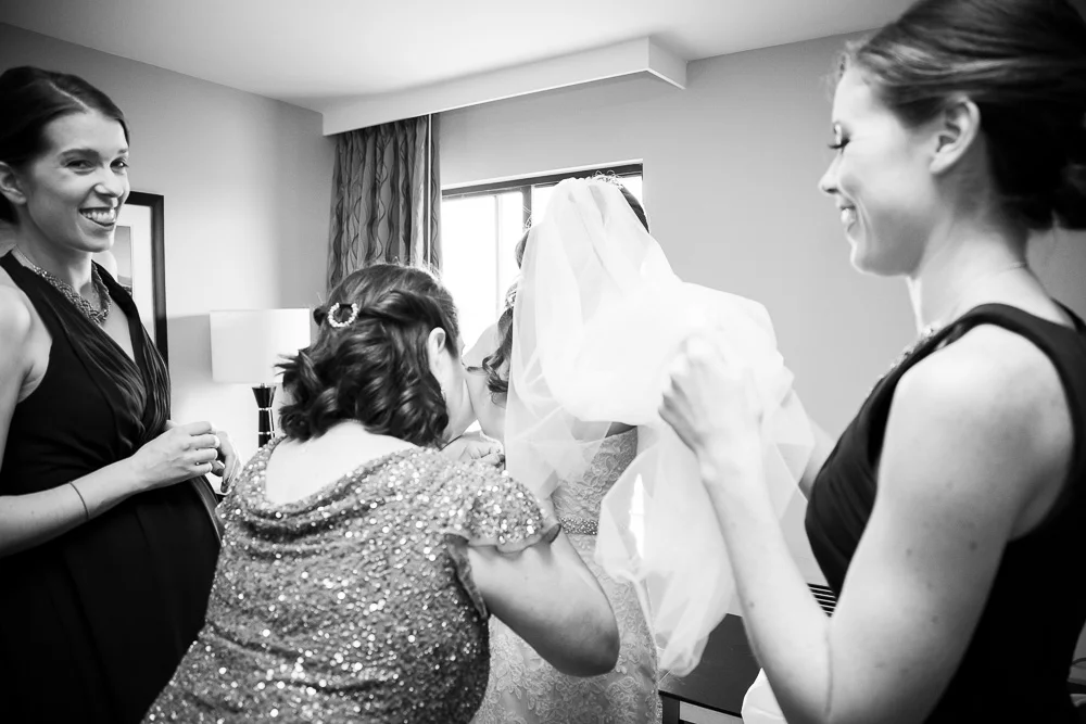 Putting on the wedding dress | Candid wedding photographer | Megan Rei Photography