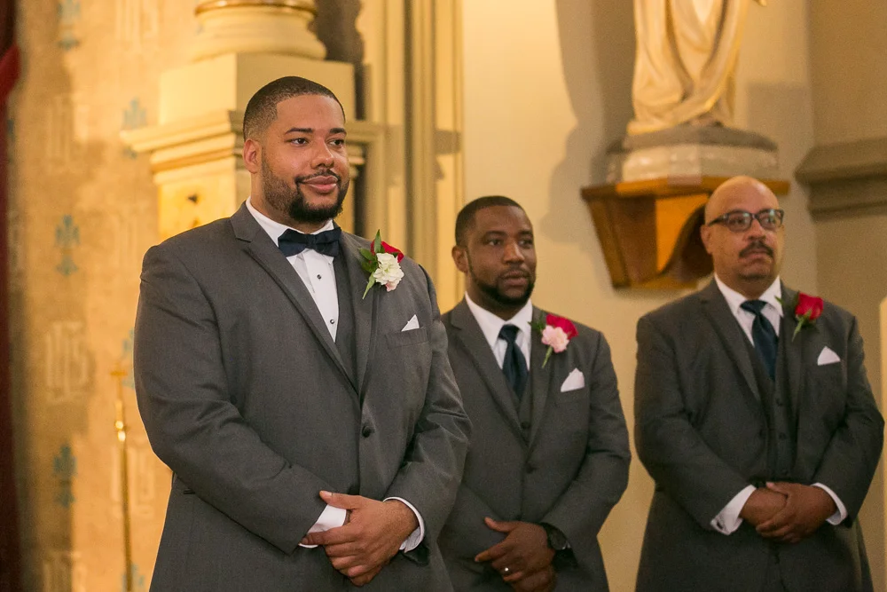 Groom watching his bride come down the aisle | Photojournalistic Wedding Photography in Rochester, NY