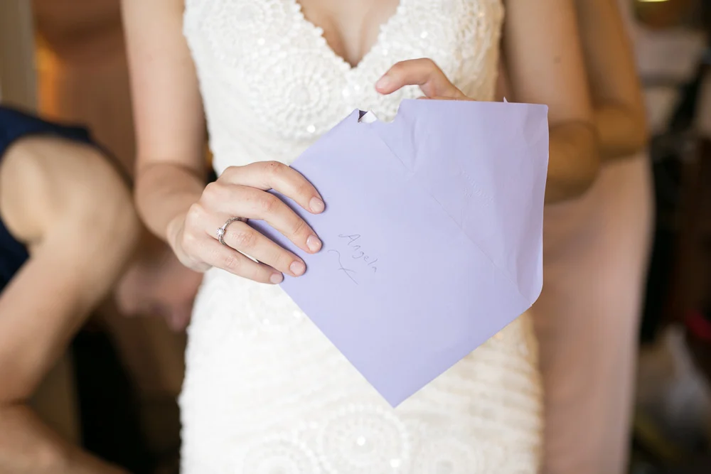 Opening a letter from the groom | Documentary wedding photography in Northern Virginia