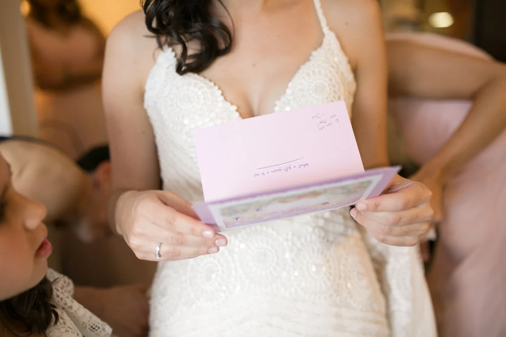 Exchanging letters on the wedding day | Wedding detail photographer