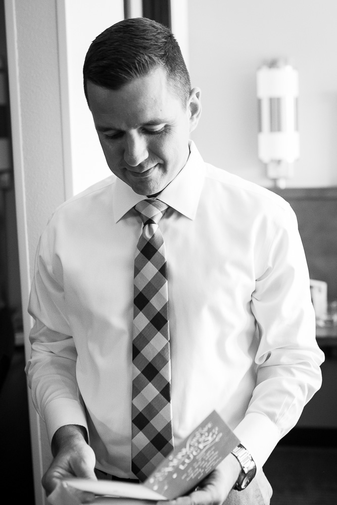 Groom reading a letter from the bride | Documentary Style Wedding Photography in Northern Virginia