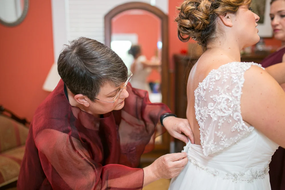 Putting on the wedding dress in the bridal suite at Mountain Run Winery | Documentary Northern Virginia Wedding Photographer